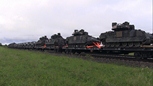 Freight train loaded with military technics